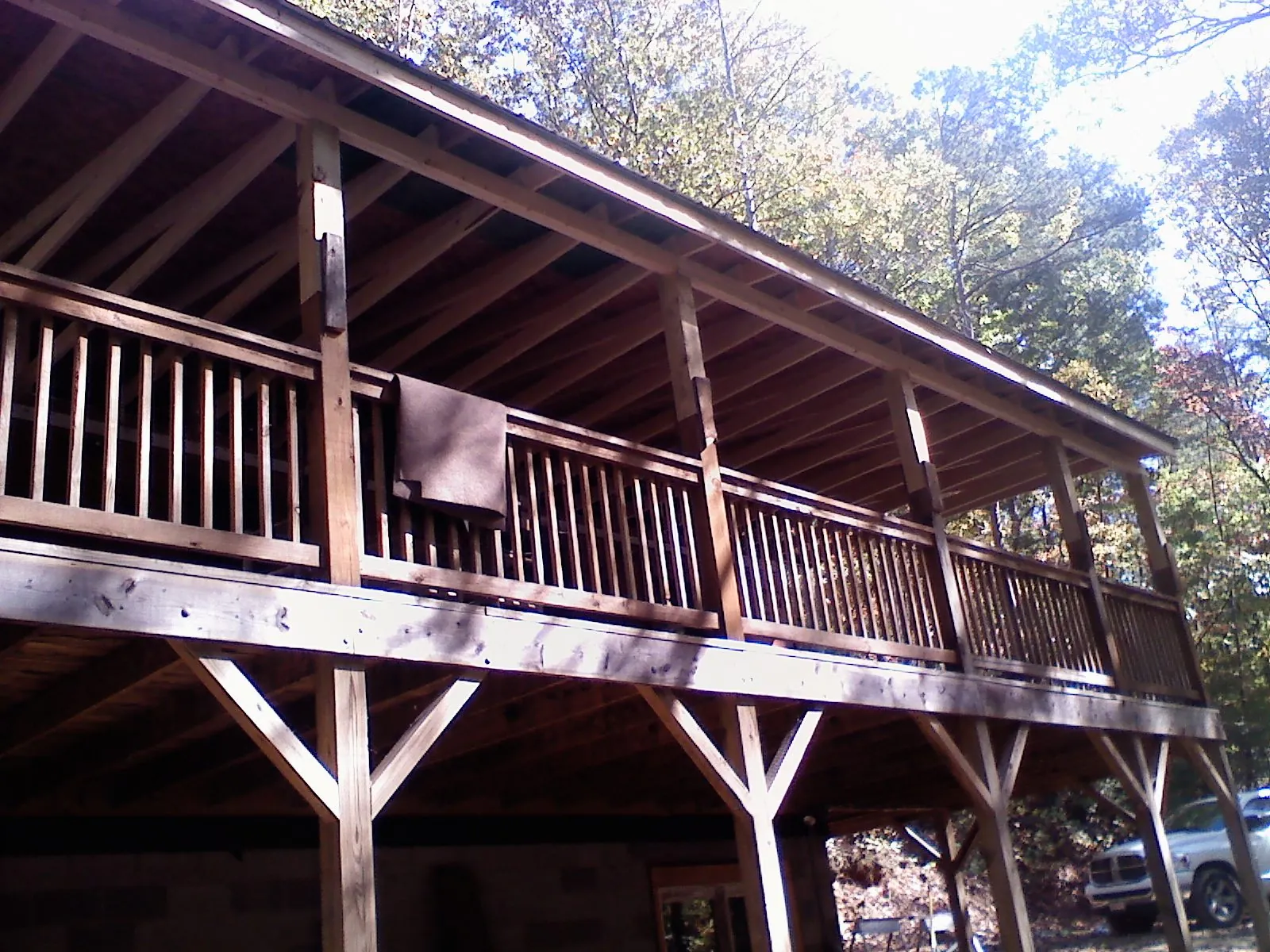 Timber framing under a new elevated porch and deck — Roof Leak Repair in Grand Blanc by Roofing Brothers